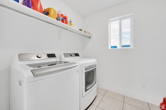 1373 E Bell Buoy Way S, Eagle Mountain, UT 84005 - washroom with washer and dryer, baseboards, laundry area, and light tile patterned floors
