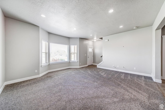 8052 N Rock Creek Cove Ln, Eagle Mountain, UT 84005 - unfurnished living room with recessed lighting, baseboards, and carpet