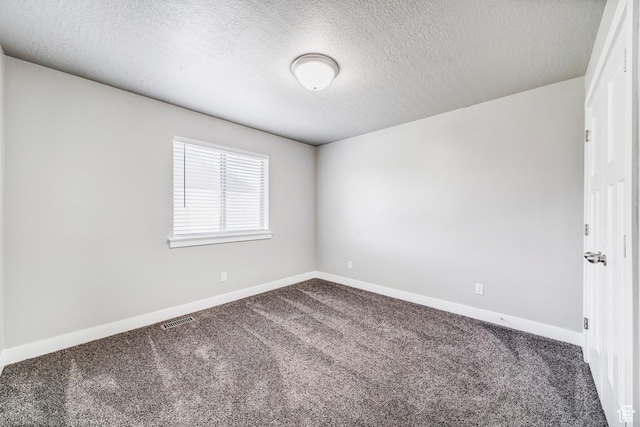 8052 N Rock Creek Cove Ln, Eagle Mountain, UT 84005 - empty room with baseboards, visible vents, carpet floors, and a textured ceiling