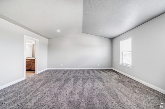 8052 N Rock Creek Cove Ln, Eagle Mountain, UT 84005 - unfurnished room with carpet, baseboards, vaulted ceiling, recessed lighting, and a textured ceiling