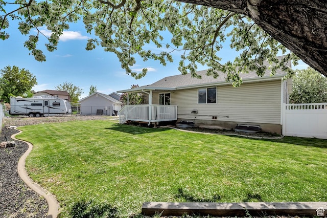 1354 N 2950 W, Clinton, UT 84015 - back of property with a wooden deck, a lawn, and fence