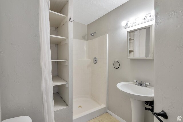 1354 N 2950 W, Clinton, UT 84015 - full bathroom featuring a shower stall, toilet, and a textured wall