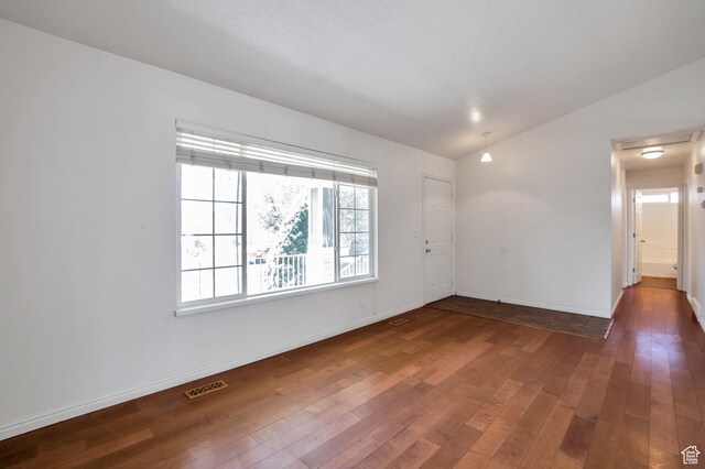 1354 N 2950 W, Clinton, UT 84015 - spare room with visible vents, baseboards, lofted ceiling, and wood-type flooring