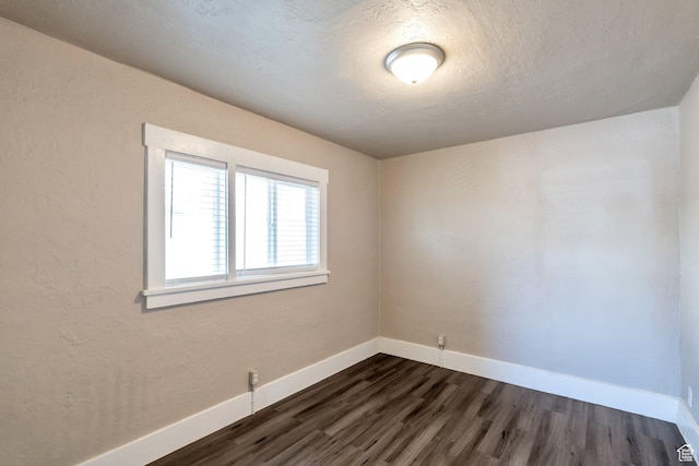 252 E 31st S, Ogden, UT 84401 - spare room with dark wood-style floors, baseboards, a textured wall, and a textured ceiling