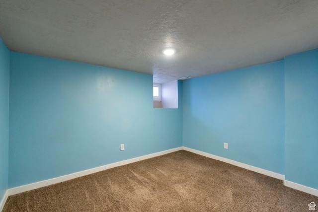 252 E 31st S, Ogden, UT 84401 - below grade area featuring baseboards, carpet floors, and a textured ceiling