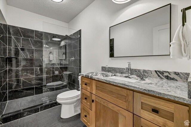 4875 N Vialetto Way, Lehi, UT 84043 - full bath with vanity, a walk in shower, a textured ceiling, tile patterned floors, and toilet