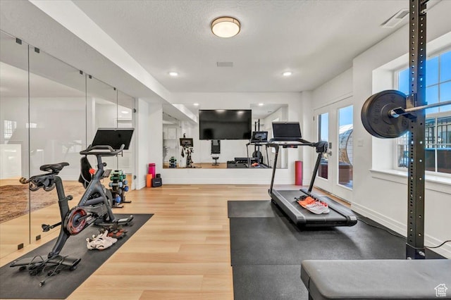 4875 N Vialetto Way, Lehi, UT 84043 - exercise room with visible vents, baseboards, french doors, wood finished floors, and a textured ceiling