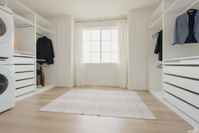 4875 N Vialetto Way, Lehi, UT 84043 - walk in closet featuring wood finished floors and stacked washer and clothes dryer