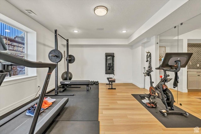 4875 N Vialetto Way, Lehi, UT 84043 - exercise room featuring wood finished floors, visible vents, baseboards, recessed lighting, and a textured ceiling