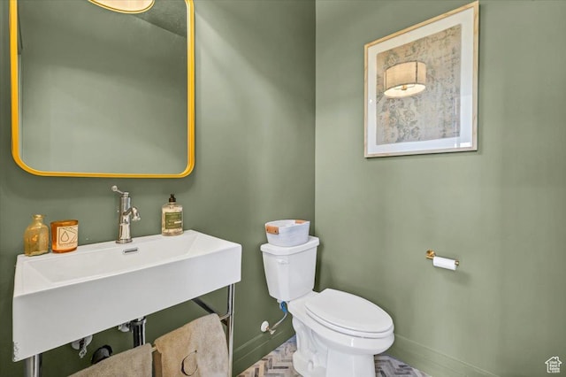 4875 N Vialetto Way, Lehi, UT 84043 - half bathroom featuring toilet, baseboards, and a sink