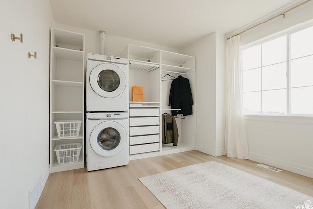 4875 N Vialetto Way, Lehi, UT 84043 - laundry area with visible vents, laundry area, stacked washing maching and dryer, and wood finished floors