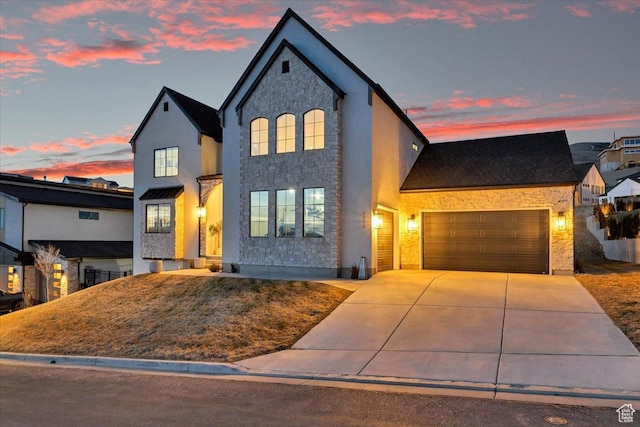4875 N Vialetto Way, Lehi, UT 84043 - view of front of house with stone siding, stucco siding, concrete driveway, and a garage