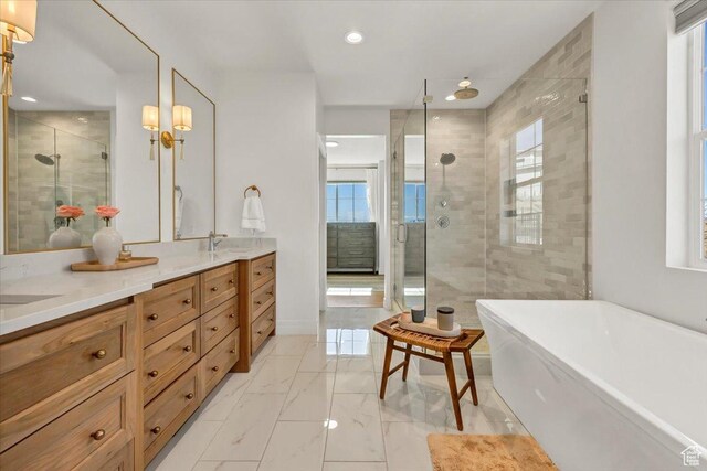 4875 N Vialetto Way, Lehi, UT 84043 - bathroom with marble finish floor, a stall shower, a freestanding tub, and a sink
