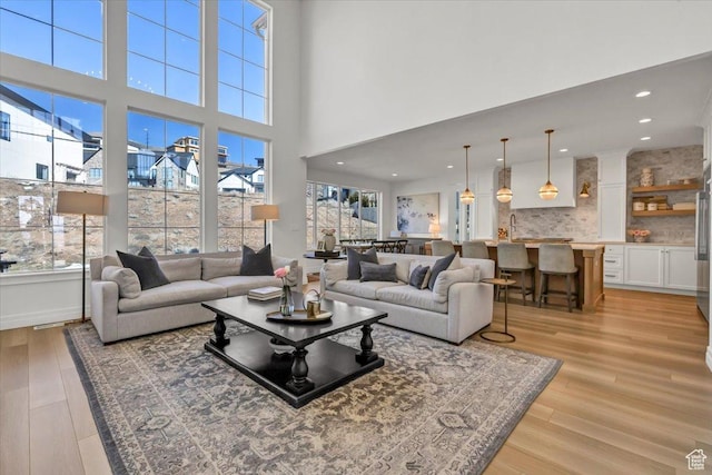 4875 N Vialetto Way, Lehi, UT 84043 - living room with a high ceiling, recessed lighting, and light wood-type flooring