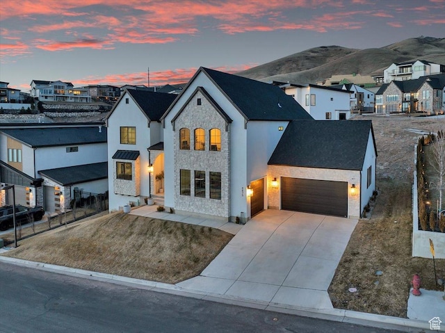 4875 N Vialetto Way, Lehi, UT 84043 - view of front facade with stone siding, a garage, a residential view, and driveway