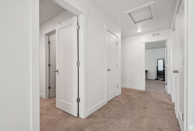 4905 E Lake Corner Dr, Eagle Mountain, UT 84005 - hallway with visible vents, light colored carpet, attic access, and baseboards