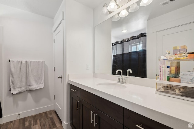 4905 E Lake Corner Dr, Eagle Mountain, UT 84005 - bathroom with visible vents, vanity, baseboards, and wood finished floors