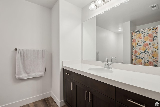 4905 E Lake Corner Dr, Eagle Mountain, UT 84005 - full bathroom featuring visible vents, vanity, baseboards, and wood finished floors