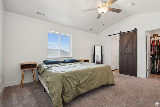 4905 E Lake Corner Dr, Eagle Mountain, UT 84005 - bedroom featuring visible vents, vaulted ceiling, a spacious closet, light carpet, and a barn door