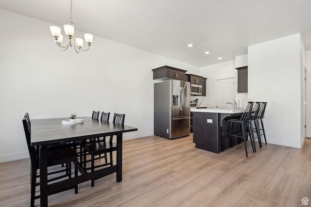 4905 E Lake Corner Dr, Eagle Mountain, UT 84005 - dining space featuring recessed lighting, baseboards, light wood-style floors, and a chandelier