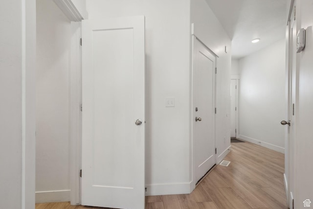 4905 E Lake Corner Dr, Eagle Mountain, UT 84005 - hallway featuring visible vents, light wood-style flooring, and baseboards