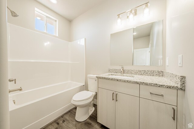 4377 E Colt Cir, Kanab, UT 84741 - bathroom featuring toilet,  shower combination, wood finished floors, and vanity