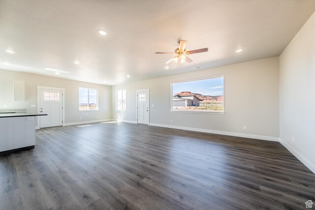 4377 E Colt Cir, Kanab, UT 84741 - unfurnished living room featuring recessed lighting, dark wood-style floors, baseboards, and ceiling fan