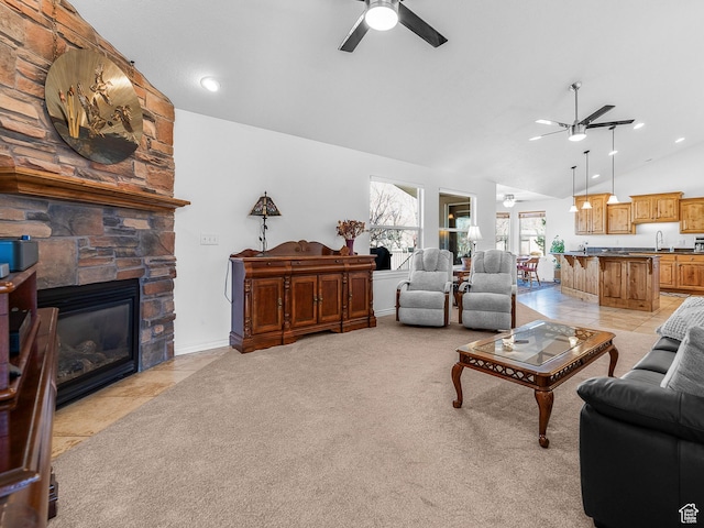 3265 N 1050 W, Pleasant View, UT 84414 - living area with light carpet, a ceiling fan, recessed lighting, a stone fireplace, and light tile patterned flooring