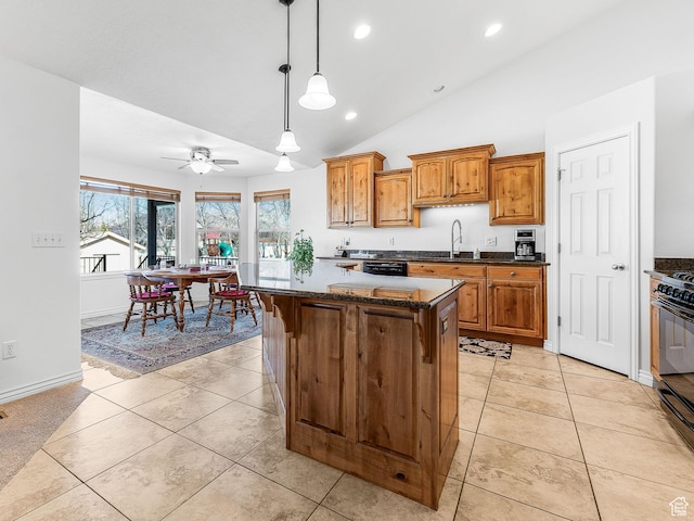 3265 N 1050 W, Pleasant View, UT 84414 - kitchen with brown cabinets, black appliances, decorative light fixtures, a kitchen island, and light tile patterned flooring