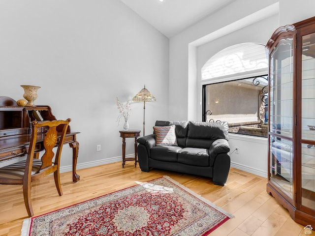 3265 N 1050 W, Pleasant View, UT 84414 - living area featuring vaulted ceiling, baseboards, and wood finished floors