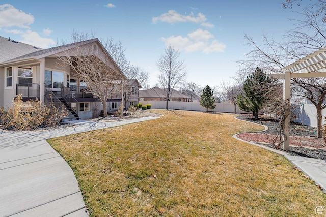 3265 N 1050 W, Pleasant View, UT 84414 - view of yard with a wooden deck, a pergola, stairs, and a fenced backyard