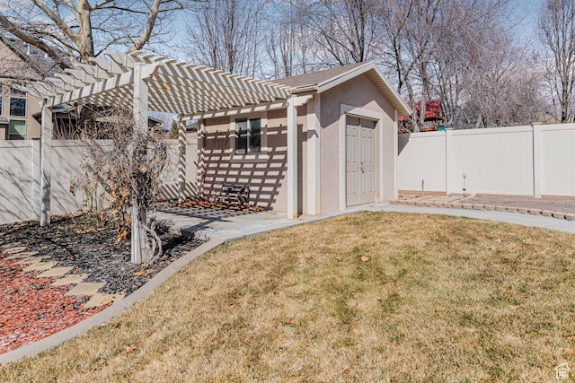 3265 N 1050 W, Pleasant View, UT 84414 - view of yard featuring an outbuilding, a fenced backyard, and a pergola