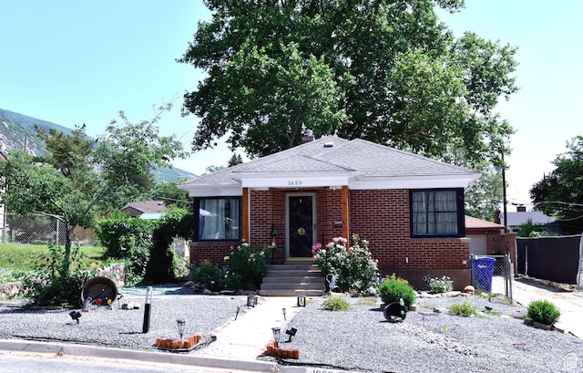 1653 E Lake St, Ogden, UT 84401 - bungalow featuring brick siding and a shingled roof