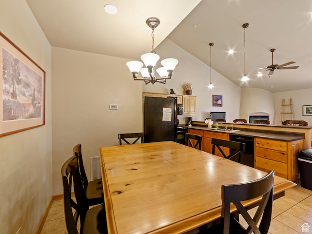 2 Desert Wind Dr Unit 2, Moab, UT 84532 - dining area with lofted ceiling, light tile patterned flooring, ceiling fan with notable chandelier, and visible vents