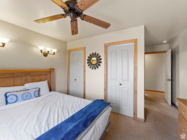 2 Desert Wind Dr Unit 2, Moab, UT 84532 - bedroom with baseboards, light colored carpet, and a ceiling fan