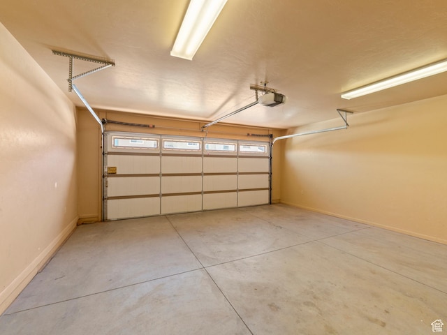 2 Desert Wind Dr Unit 2, Moab, UT 84532 - garage with baseboards and a garage door opener