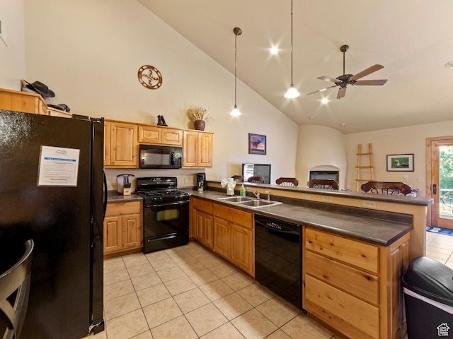 2 Desert Wind Dr Unit 2, Moab, UT 84532 - kitchen featuring black appliances, dark countertops, light tile patterned floors, and a peninsula