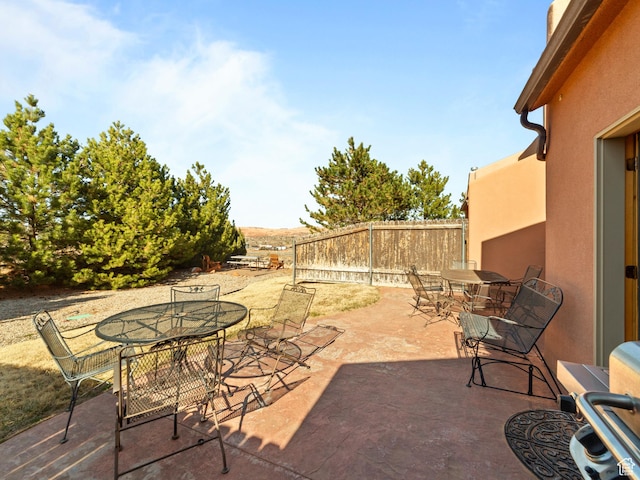 2 Desert Wind Dr Unit 2, Moab, UT 84532 - view of patio featuring outdoor dining space and fence