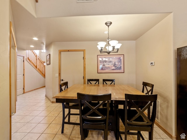 2 Desert Wind Dr Unit 2, Moab, UT 84532 - dining room with light tile patterned floors, stairway, visible vents, and baseboards