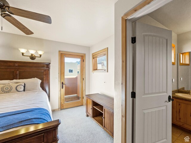 2 Desert Wind Dr Unit 2, Moab, UT 84532 - bedroom featuring a sink, access to exterior, ceiling fan, and light carpet