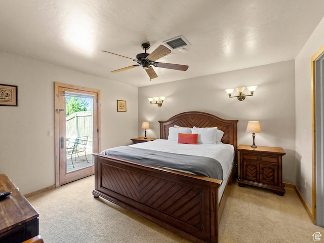2 Desert Wind Dr Unit 2, Moab, UT 84532 - bedroom with visible vents, light colored carpet, baseboards, and access to outside