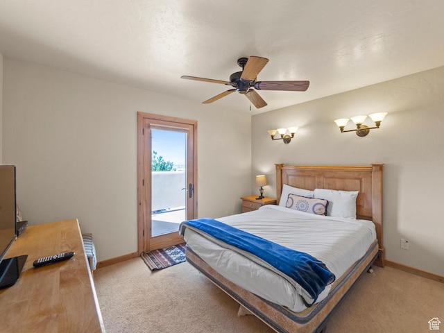 2 Desert Wind Dr Unit 2, Moab, UT 84532 - bedroom featuring light carpet, a ceiling fan, baseboards, and access to outside