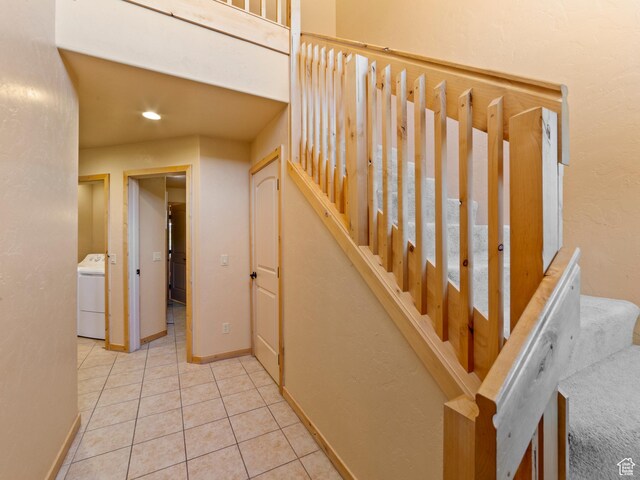 2 Desert Wind Dr Unit 2, Moab, UT 84532 - staircase featuring tile patterned floors, washer / clothes dryer, and baseboards