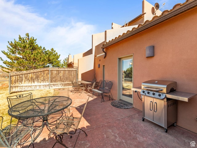 2 Desert Wind Dr Unit 2, Moab, UT 84532 - view of patio with outdoor dining space, area for grilling, and fence