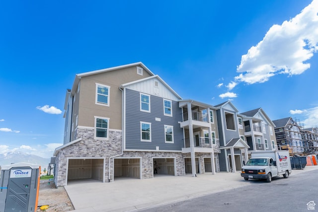 13687 S Hanley Ln Unit Dd301, Riverton, UT 84096 - view of building exterior with an attached garage and concrete driveway