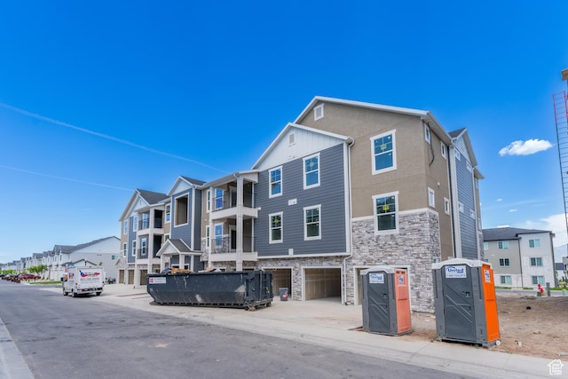 13687 S Hanley Ln Unit Dd301, Riverton, UT 84096 - view of building exterior featuring a residential view and a garage