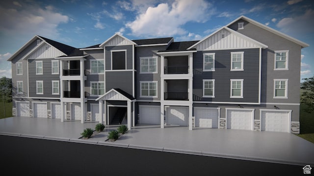 13687 S Hanley Ln Unit Dd301, Riverton, UT 84096 - townhome / multi-family property featuring board and batten siding, driveway, and a garage