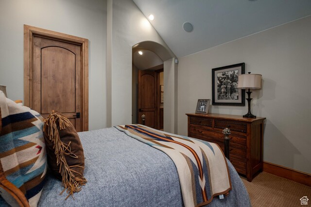 8376 E Aspen Rdg Unit 44, Heber City, UT 84032 - bedroom featuring arched walkways, carpet, and vaulted ceiling