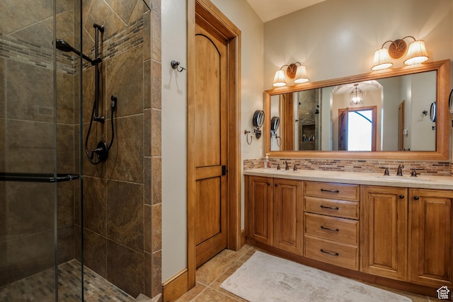 8376 E Aspen Rdg Unit 44, Heber City, UT 84032 - bathroom featuring a tile shower, double vanity, backsplash, and tile patterned flooring