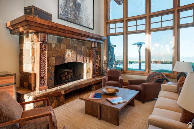 8376 E Aspen Rdg Unit 44, Heber City, UT 84032 - living room with healthy amount of natural light, a fireplace, a towering ceiling, and a water view